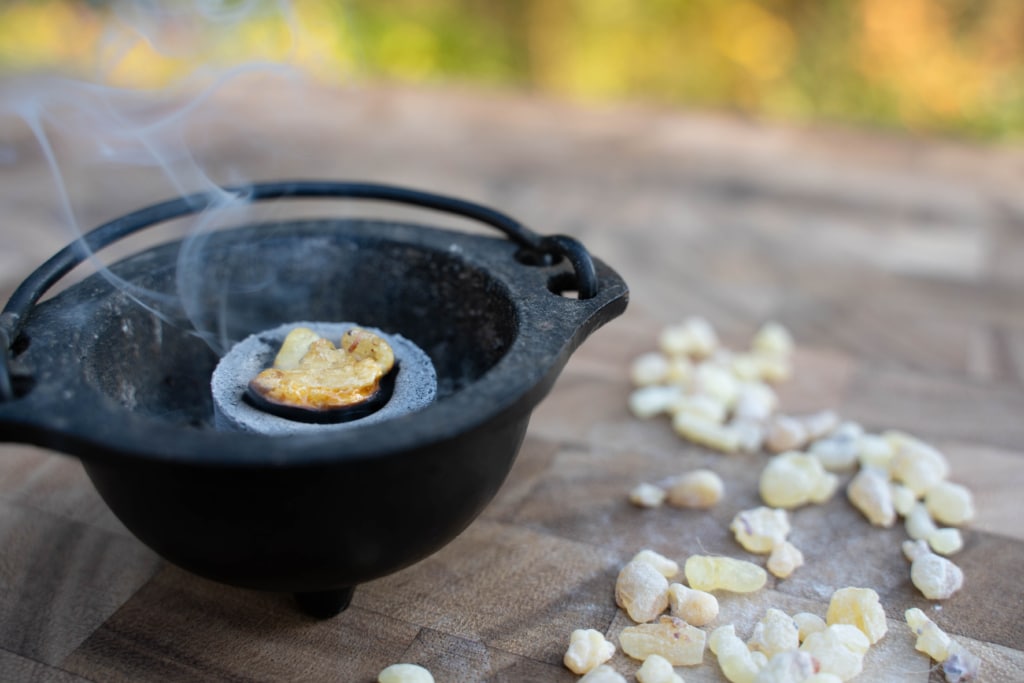 frankincense resin burning on incense charcoal